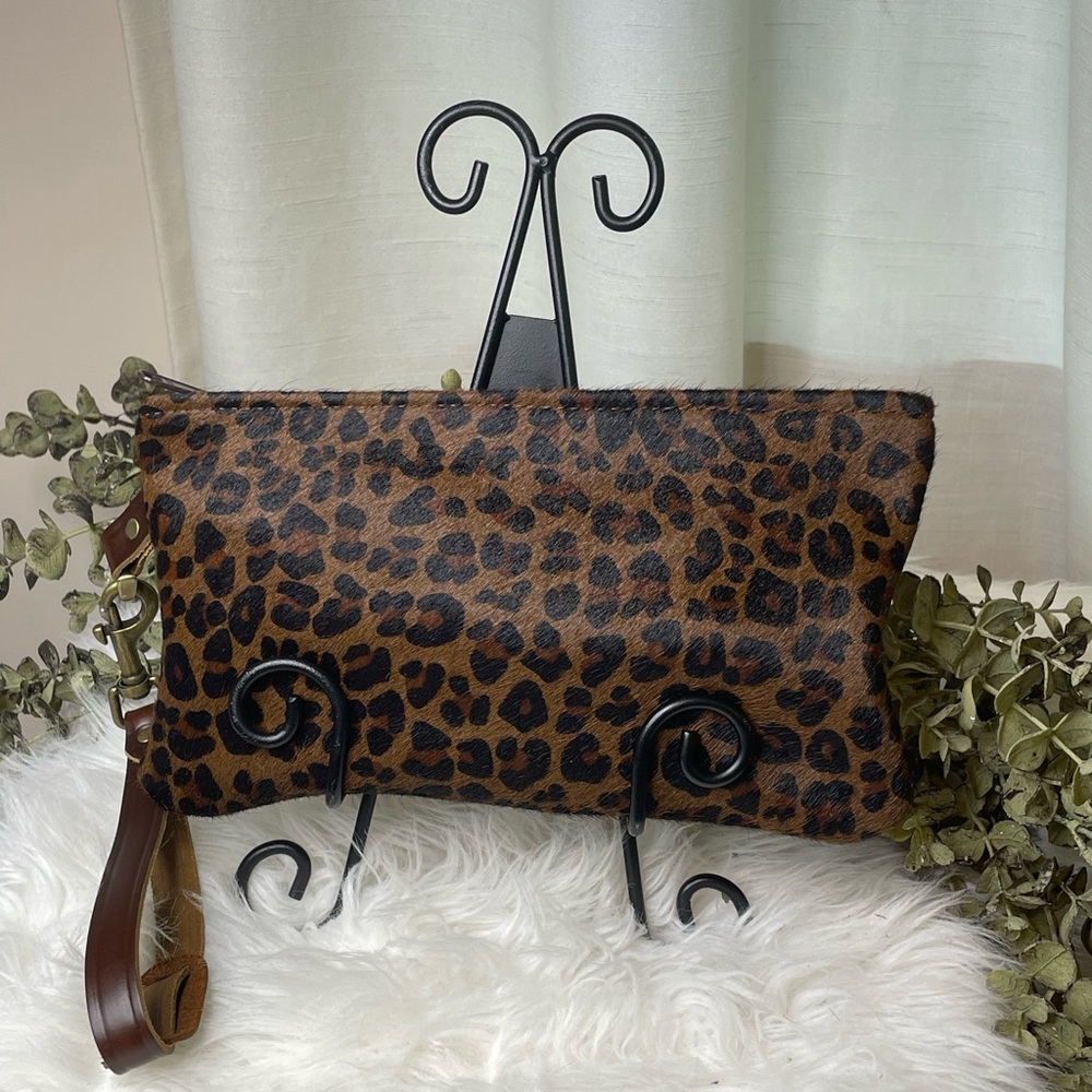 Cowhide Wristlet timeless leather print hair on hide. Zipper closure, strap